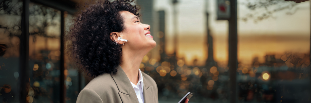 lady enjoying tri-tek pro PURE wireless earbuds