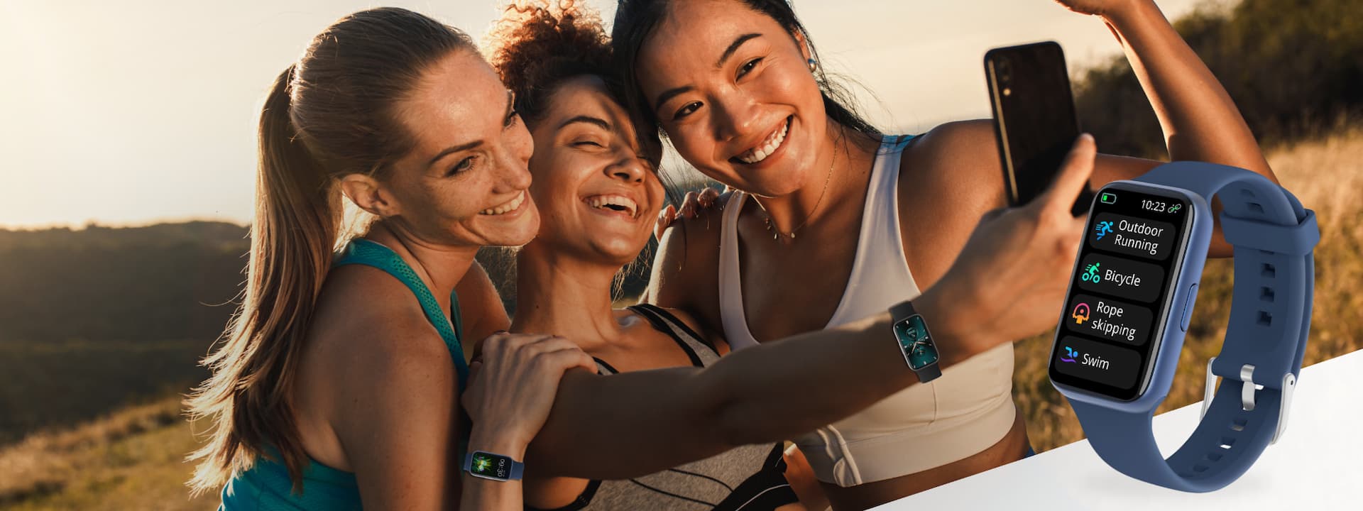 Three women taking a selfie outdoors with fitness trackers on their wrists.